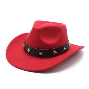 Detail of red wool felt cowboy hat featuring a black leather band with silver star studs