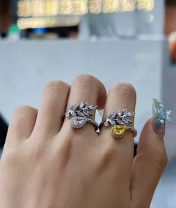 Detailed view of pear-cut zircon and leaf motif on adjustable 925 silver rings