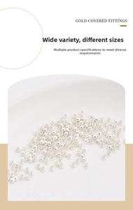 Macro view of assorted silver beads and positioning tubes for DIY jewelry making