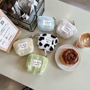 Mini plush cosmetic bags in five colors with a portable strap and soft faux fur texture