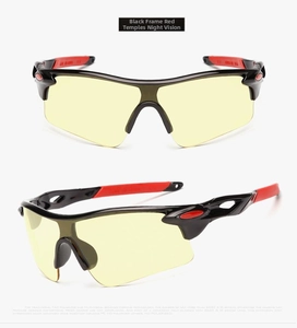 Detail view of polarized night vision cycling glasses with black frame and red temples