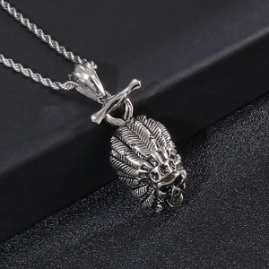 Macro detail of silver titanium steel Indian chief skull pendant with feather headdress