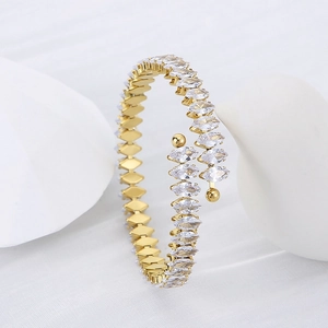 Macro shot of 18K gold plated bangle with sparkling marquise-cut white zircons