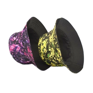 Detail of double-sided tie-dye bucket hat showing marble pattern and clean edge stitching
