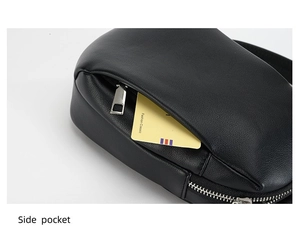 Close-up of black lychee leather waist bag side pocket with silver metal zipper detail