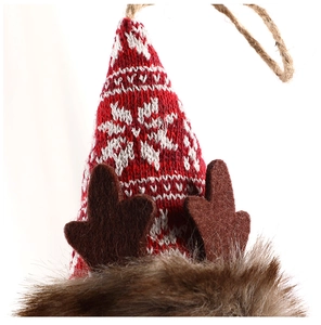 Detail of Christmas reindeer ornament with red snowflake knit hat and brown felt antlers