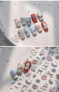 Close-up of cute cartoon nail stickers with laser glitter effect and rabbit patterns