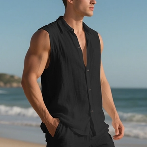 Men's sleeveless black linen beach shirt showing breathable fabric texture in sunlight