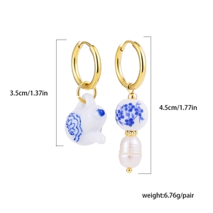 Detailed view of porcelain rabbit and pearl drop earrings with dimensions and weight info