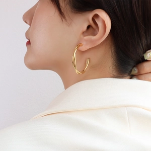 Elegant 18k gold plated double layer twisted hoop earrings for women in a sleek minimalist style