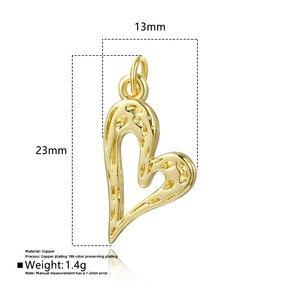 Detail view of 18k gold plated hollow heart pendant with hammered texture and mirror reflection