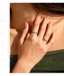 Detailed view of S925 silver stackable rings with turquoise stones and vintage charm