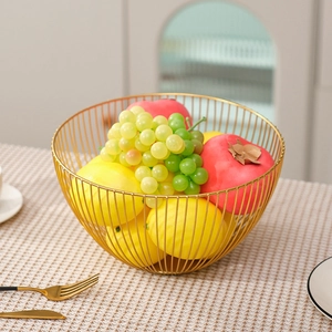 Modern gold wire metal fruit bowl for kitchen countertop with minimalist hollow design