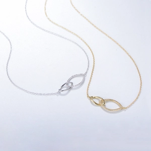 Minimalist double interlocking silver and gold loop necklace with sparkling micro-pave stones