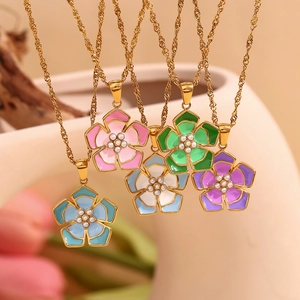 Detailed close-up of five 18K gold-plated flower necklaces with colorful enamel petals
