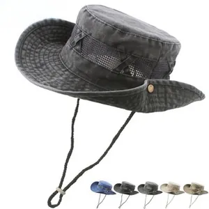 Detail of adjustable windproof strap and side snap buttons on cotton bucket hat