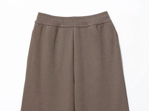 Detail of high-density knit cotton sweatpants with elastic waistband and fine stitching