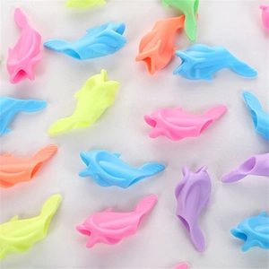 Colorful dolphin-shaped silicone pencil grips for kids to correct writing posture