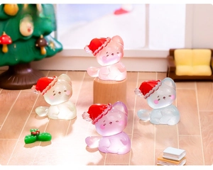 Detailed view of miniature luminous resin Christmas cats in a cozy micro-landscape setting