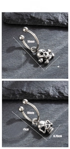 Detailed view of silver titanium steel horseshoe ring featuring a punk skull pendant