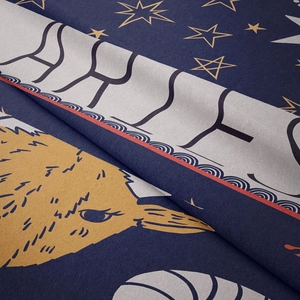 Detailed close-up of soft flannel Aries zodiac tapestry with gold stars and blue fabric