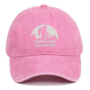 Pink washed cotton baseball cap with Bigfoot embroidery and Hide Seek Champion text