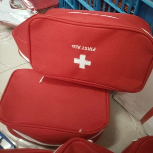 Portable large red First Aid medical bag made of durable Oxford fabric with handle