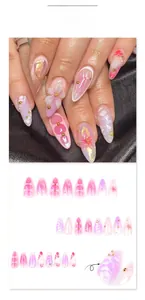 Detailed view of 3D floral nail charms and pink marble press-on nails on black silk