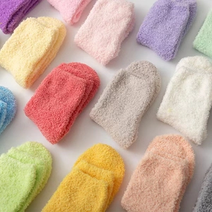 Thick coral fleece mid-calf socks in various soft pastel colors for winter warmth