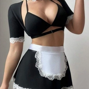 Black and white maid cosplay outfit with lace trim apron and halter top on model