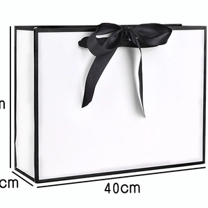 Minimalist white paper gift bag with black trim and ribbon bow, 40cm large size