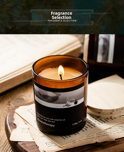 Macro shot of 140g soy wax essential oil candle in amber glass jar with wooden lid