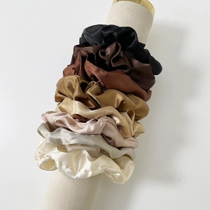 7-piece satin hair scrunchies set in neutral gradient earth tones on white stand
