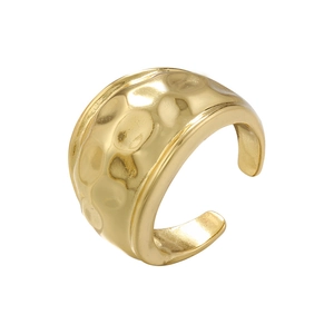 Detailed view of wide gold open ring with irregular hammered metal texture surface