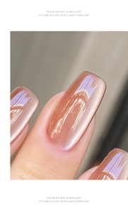 Macro shot of pinkish brown cat eye nail polish with reflective texture and high gloss