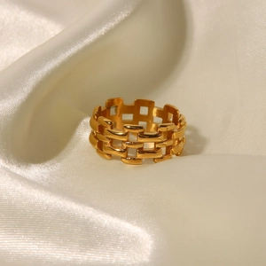 18K gold plated hollow weave watch band style ring for women on silk background