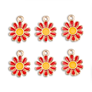 Detail of six red daisy charms with yellow centers and gold plating for DIY jewelry
