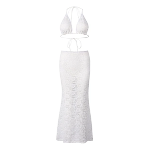 Detail of white lace two-piece set featuring halter crop top and high-waist mermaid skirt