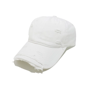 Detail showing distressed holes and frayed edges on white vintage cotton baseball cap
