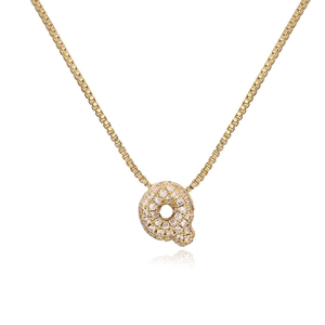 Close-up of a gold box chain necklace with a rhinestone studded letter Q pendant charm
