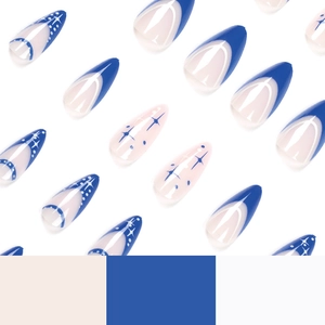 Blue and white French press-on nails with starburst and dot patterns in almond shape