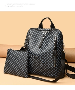 Detail view of large capacity black printed backpack with matching pouch on beige background
