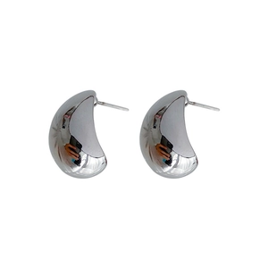 Minimalist silver C-shape metal stud earrings with polished drop design on white background