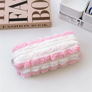 Detail of pink and white striped bubble fabric stationery pouch with soft texture