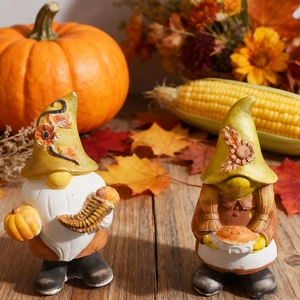 Detailed harvest gnome figurines with pumpkin and maple leaf decorations for autumn decor