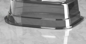 Macro detail of a thick gray translucent plastic basin showing smooth rounded edges