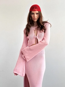 Detailed knit texture of pink long sleeve tie-up cardigan and slit maxi skirt set
