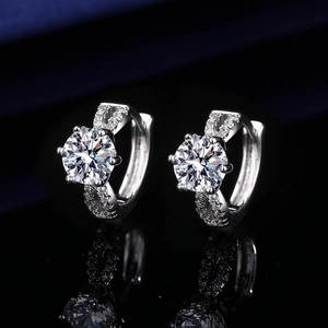 Macro detail of silver studs featuring heart shaped zircon stones and pavé setting