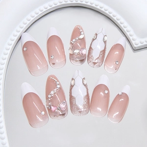 Sparkling silver snake press-on nails with 3D pink heart crystals and glitter ombré