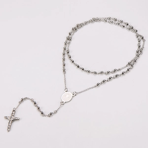 Detailed close-up of a 304 stainless steel rosary necklace with a cross and holy medal
